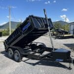 Telescopic dump trailer raised, rear three-quarter view