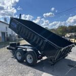 Telescopic dump trailer with the bed fully extended