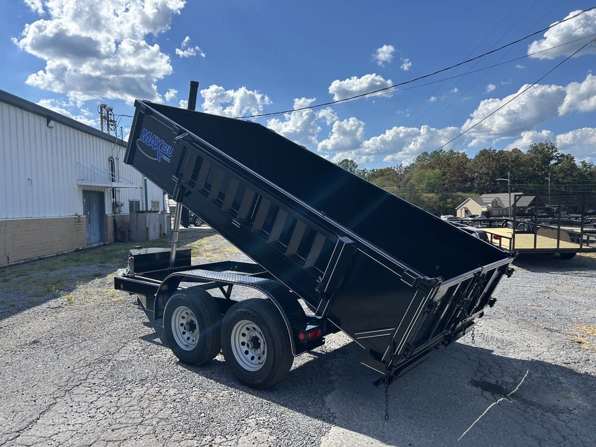 Telescopic dump trailer with the bed fully extended