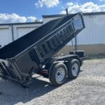 Telescopic dump trailer raised on the lot