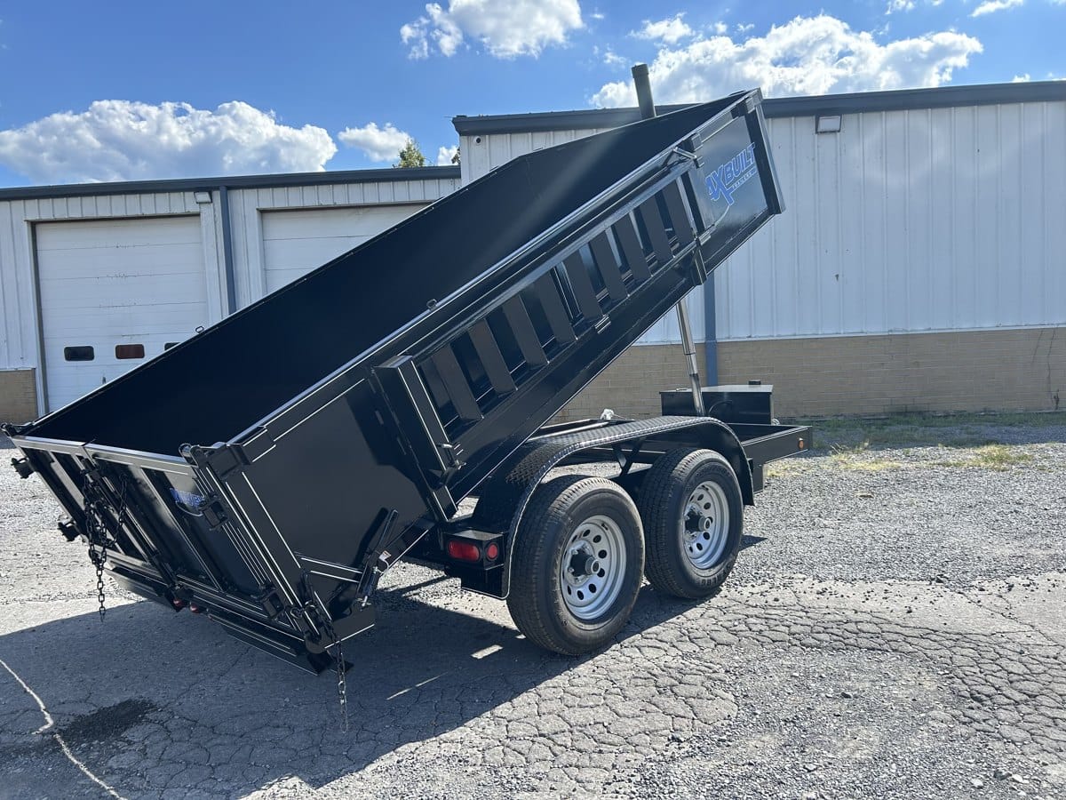 Telescopic dump trailer raised on the lot